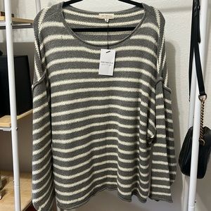 Beautiful stripes sweater with over the shoulder style of you want .